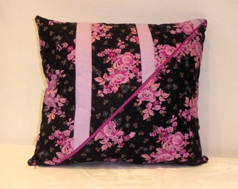 Black cushion with pink flowers