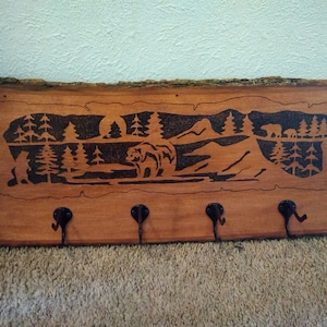 Wood burned coat rack