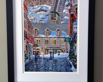 May include: A framed painting depicting a winter street scene with a funicular climbing a hill. The artwork features stone buildings, snow-covered ground, and people walking on a cobblestone path. The text "FUNICULAIRE" is visible on a building facade.