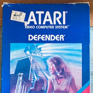 1981 Atari 2600 Video Game “Defender” with Original Box, Manual, & Comic Book
