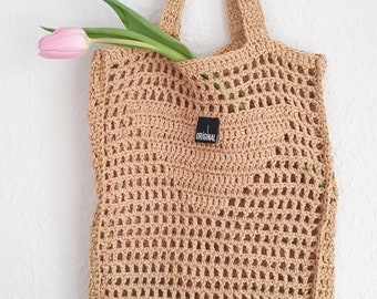 Crocheted mesh bag in designer style