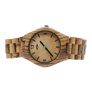 May include: A wooden wristwatch with a brown wood band and a light brown face. The watch face has black numbers and hands, and a blue second hand.