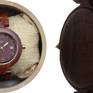 May include: A dark red wooden wristwatch with a gold face and hands. The watch is in a brown box with a beige fabric lining. The back of the watch has the words "HANDMADE NATURAL WOOD WATCH" engraved on it.