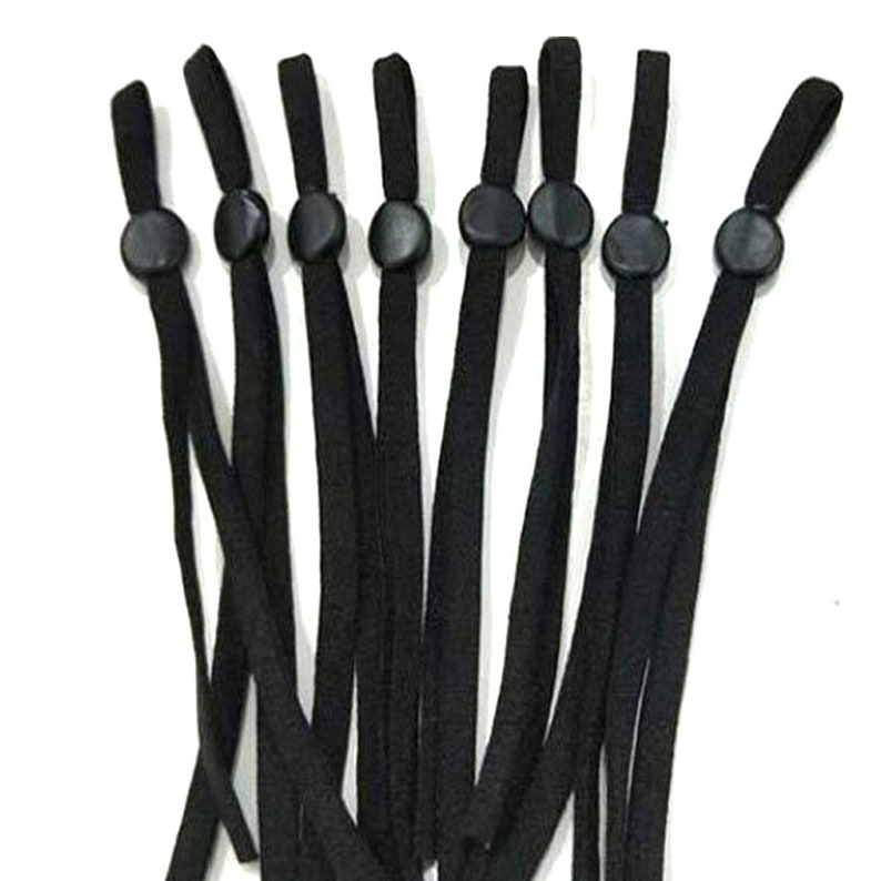 May include: Ten black elastic straps with black plastic adjustable toggles. The straps are approximately 20 inches long.
