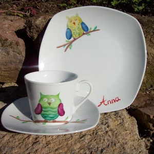 Children's set with colorful owl in desired color hand painted from cup and breakfast plate made of porcelain