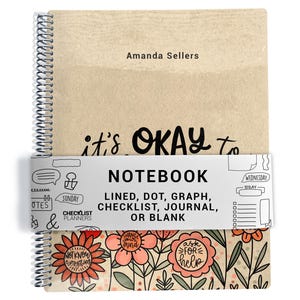 May include: A spiral-bound notebook with a kraft paper cover. The cover has the text "Amanda Sellers" and "it's OKAY to". A band around the notebook reads "NOTEBOOK" and "LINED, DOT, GRAPH, CHECKLIST, JOURNAL, OR BLANK".