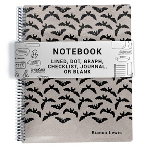 May include: A spiral-bound notebook with a tan cover featuring a repeating black bat pattern. A white paper band wraps around the center with the text: NOTEBOOK LINED, DOT, GRAPH, CHECKLIST, JOURNAL, OR BLANK, CHECKLIST PLANNERS, and Bianca Lewis.