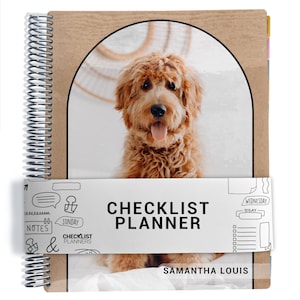 May include: A spiral-bound planner with a kraft paper cover featuring an arched window displaying a fluffy golden-brown dog. A white belly band wraps around the center with the text "CHECKLIST PLANNER" and "SAMANTHA LOUIS" alongside doodle icons.