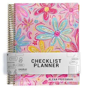 May include: A spiral-bound planner with a pink cover featuring colorful hand-drawn flowers in blue, yellow, and magenta with gold glitter accents. A white paper band wraps around the center with the text CHECKLIST PLANNER and ALEXA FRIEDMAN.