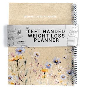 May include: A spiral-bound weight loss planner with a floral design. The cover features the text "WEIGHT LOSS PLANNER" and "LEFT HANDED WEIGHT LOSS PLANNER". The bottom half of the planner has a watercolour floral design with yellow, blue, and white flowers.