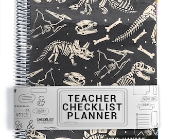 May include: A spiral-bound teacher checklist planner with a black cover featuring a white dinosaur skeleton pattern. A white paper band wraps around the center with the text "TEACHER CHECKLIST PLANNER" and "CHECKLIST PLANNERS" printed on it.