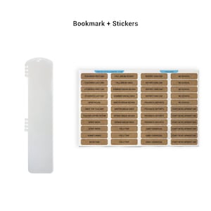 a bookmark and stickers, with the bookmark being a white plastic object and the stickers being brown cards with various labels.