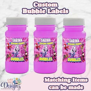 May include: Three bright pink plastic bubble bottles with white screw-on caps. Each bottle features a custom label with the text Sarina Amazing Friends Bubbles and illustrations of various superhero characters against a pink web background.