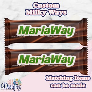 May include: Two identical chocolate candy bars with dark brown wrappers featuring the green text MariaWay Bar. The packaging includes the text net wt 1.84 oz (52.2g) and lists caramel, nougat, and chocolate. The top text reads Custom Milky Ways.