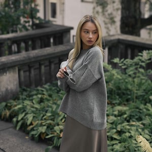 Gray knitted merino wool sweater for women, bright grey women&#39;s knit minimalist pullover with longer back, light gray jumper
