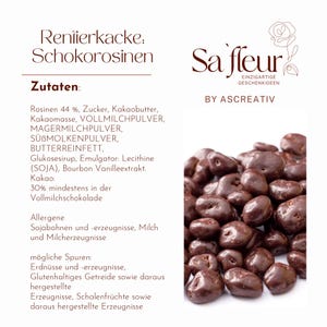 May include: A white product label featuring the text Rentierkacke: Schokorosinen, a list of ingredients, and the brand name Sa'fleur by Ascreativ. To the right, a pile of dark brown chocolate-covered raisins is displayed against a white background.