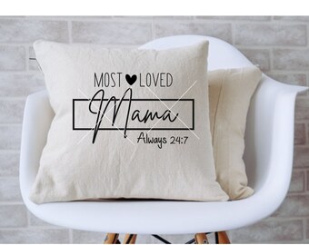 May include: A white throw pillow with black text that reads "Most Loved Mama Always 24:7". The text is in a cursive font and includes a small heart symbol.