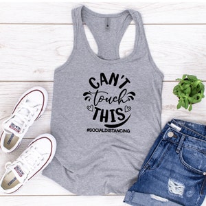 May include: Gray tank top with black text that reads "Can't touch this #SocialDistancing".