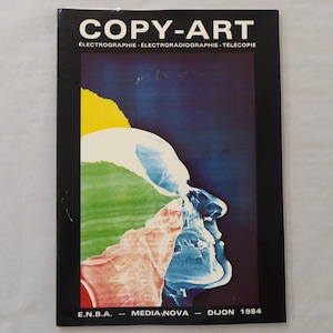May include: A magazine cover with the title "COPY-ART" in black text on a white background. The subtitle is "ÉLECTROGRAPHIE - ÉLECTRORADIOGRAPHIE - TÉLÉCOPIE" in smaller black text. The cover features a colorful abstract image of a face in profile.