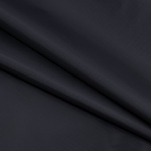 May include: Dark navy blue fabric with a subtle grid pattern. The fabric is draped, showing folds and shadows. The material appears to be smooth and possibly water-resistant, suitable for apparel or accessories.