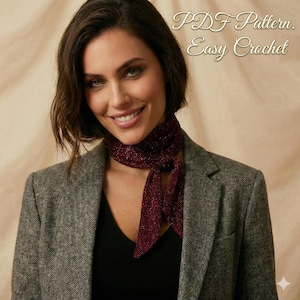 May include: A woman wearing a gray blazer and a black top, with a burgundy scarf tied around her neck. The scarf has a sparkly texture. Text on the image reads "PDF Pattern. Easy Crochet."