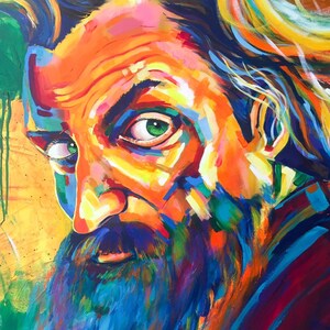 May include: A colorful painting of a man with a long beard and green eyes. The painting is done in a vibrant style with bold strokes of color.