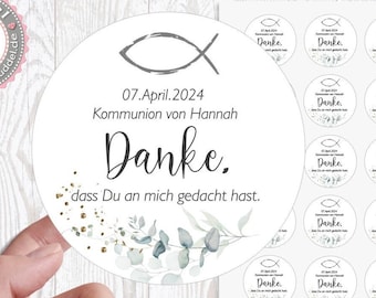 May include: A sheet of 24 round white stickers with a fish symbol, the date "07.April.2024", the text "Kommunion von Hannah", and the word "Danke."  The stickers also feature a small floral design with gold glitter.