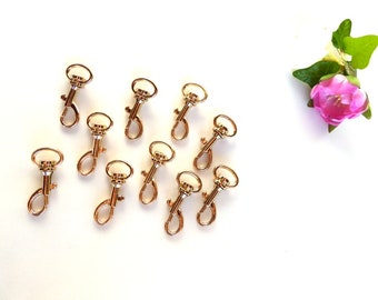 10 small snap hooks, gold