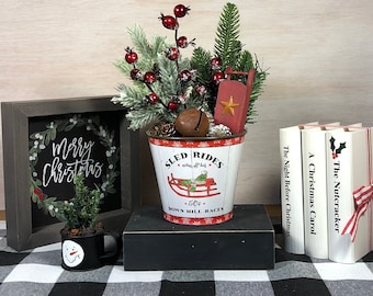 Metal Bucket with Evergreen, Red Berries, and Pine Cones featuring a Small Sled.