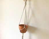 Grey and white macrame plant hanger