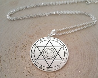 May include: Silver pendant necklace with a six-pointed star and Hebrew text. The pendant is on a silver chain.