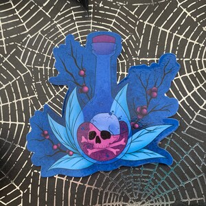 May include: A blue glass bottle with a skull and crossbones inside. The bottle is surrounded by blue and purple leaves and berries. The bottle is on a black and white spiderweb background.