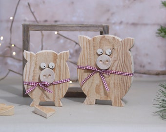 2 pigs made of natural wood