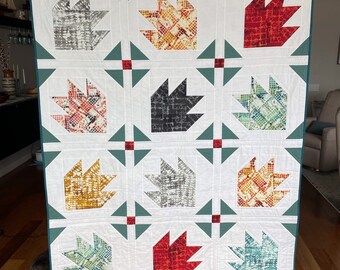 Dinosaur footprints lap quilt