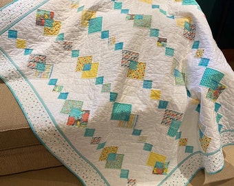 Soft pastel colour lap quilt