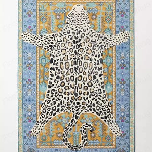 May include: A rectangular rug with a leopard skin design in black and tan spots. The rug is set against a blue and gold patterned border with floral and geometric motifs. The rug is a decorative floor covering.