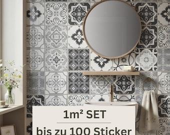 May include: A wall covered in square tiles featuring a repeating black, white, and gray geometric pattern. A round mirror with a wooden frame hangs above a sink with a wooden shelf. Text on the image reads 1m² SET bis zu 100 Sticker.