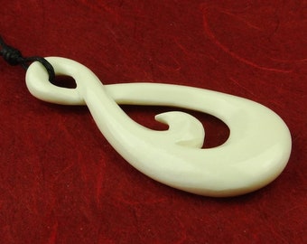 Maori pendant "Infinity" carved by hand from bone