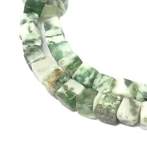 May include: A strand of green and white agate beads, each bead is a square shape.