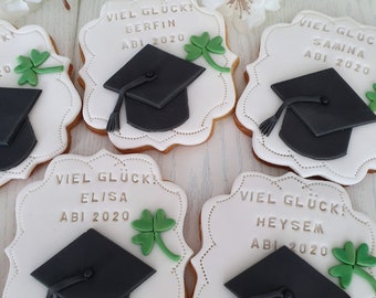 2 cookies, graduation cap, school leaving certificate