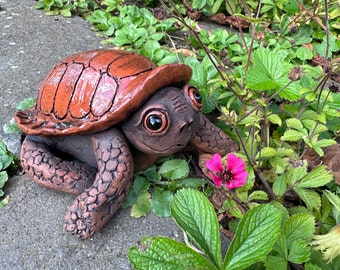 Cute turtle explores the garden