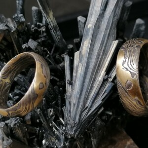 Trouwringen Mokume Gane Goud 900 Palladium 500 Zilver 925 houtnerf met ogen geëtst mokumegane