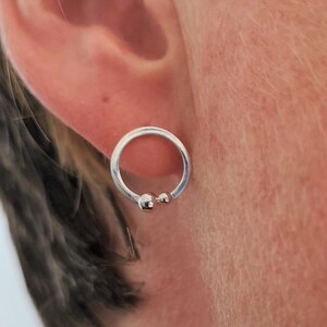 simple silver circle earrings with granule detailing