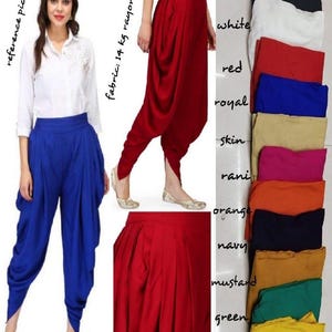 May include: The image shows a woman in blue drape dhoti salwar trousers. The trousers are a striking blue and have a distinctive draped style. Additional images show the trousers in red. A colour chart displays various colour options including black, white, red, royal, skin, rani, orange, navy, mustard, green, and lemon.