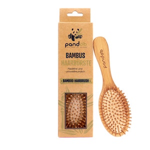 Bamboo hairbrush with natural bristles image 1