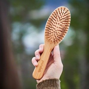 Bamboo hairbrush with natural bristles image 4