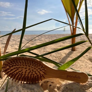 Bamboo hairbrush with natural bristles image 7