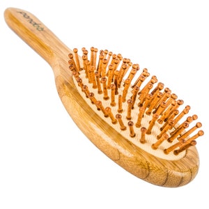 Bamboo hairbrush with natural bristles image 2