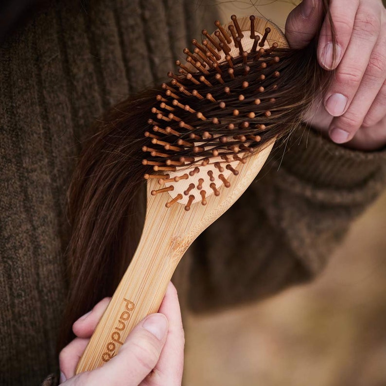 Bamboo hairbrush with natural bristles image 3