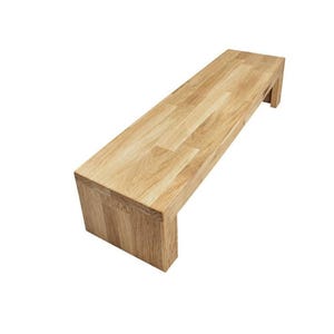May include: A rectangular bench constructed from light-coloured wood with a visible grain pattern. The bench features a flat top surface and two vertical side supports that extend to the floor, creating a clean, continuous, and solid structure.